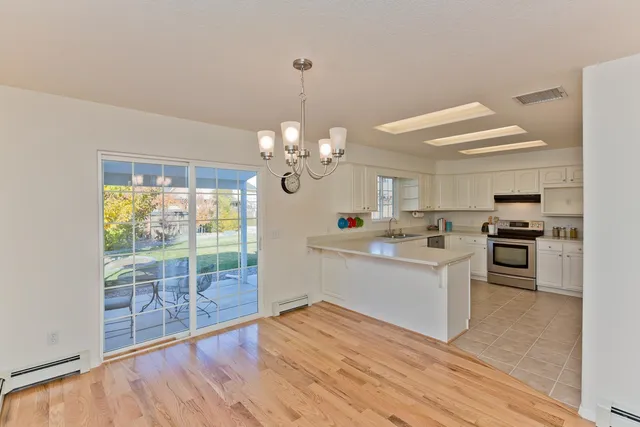 a view of a kitchen with microwave and stove