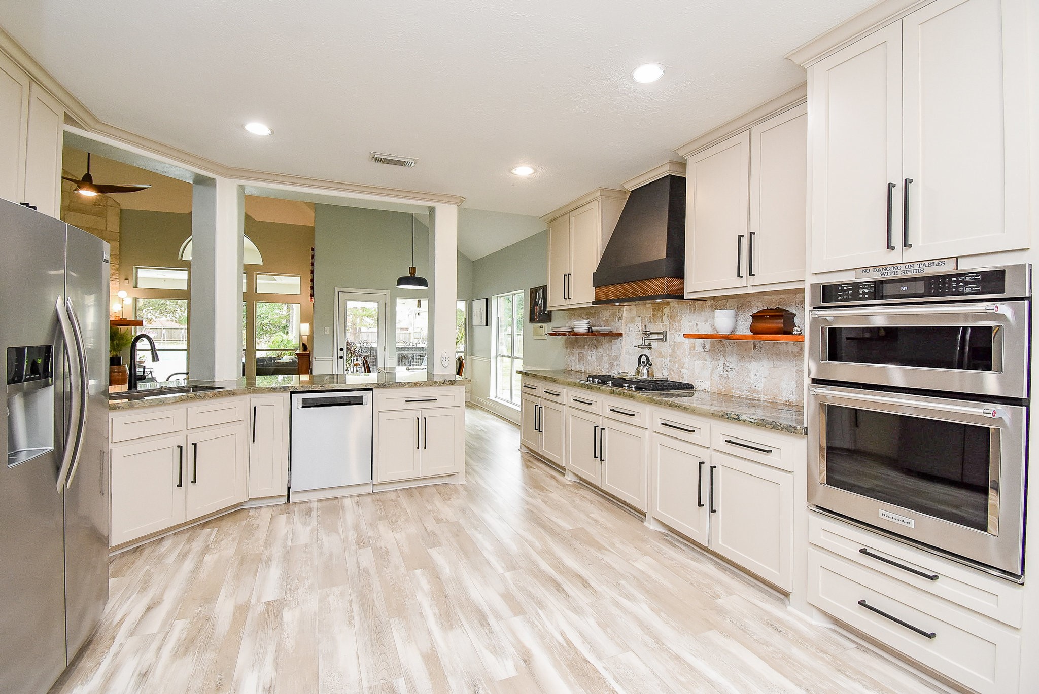 30518 Aldine Westfield Road Spring, TX 77386 - Photo 12 of 50 a large white kitchen with stainless steel appliances granite countertop a stove and a sink