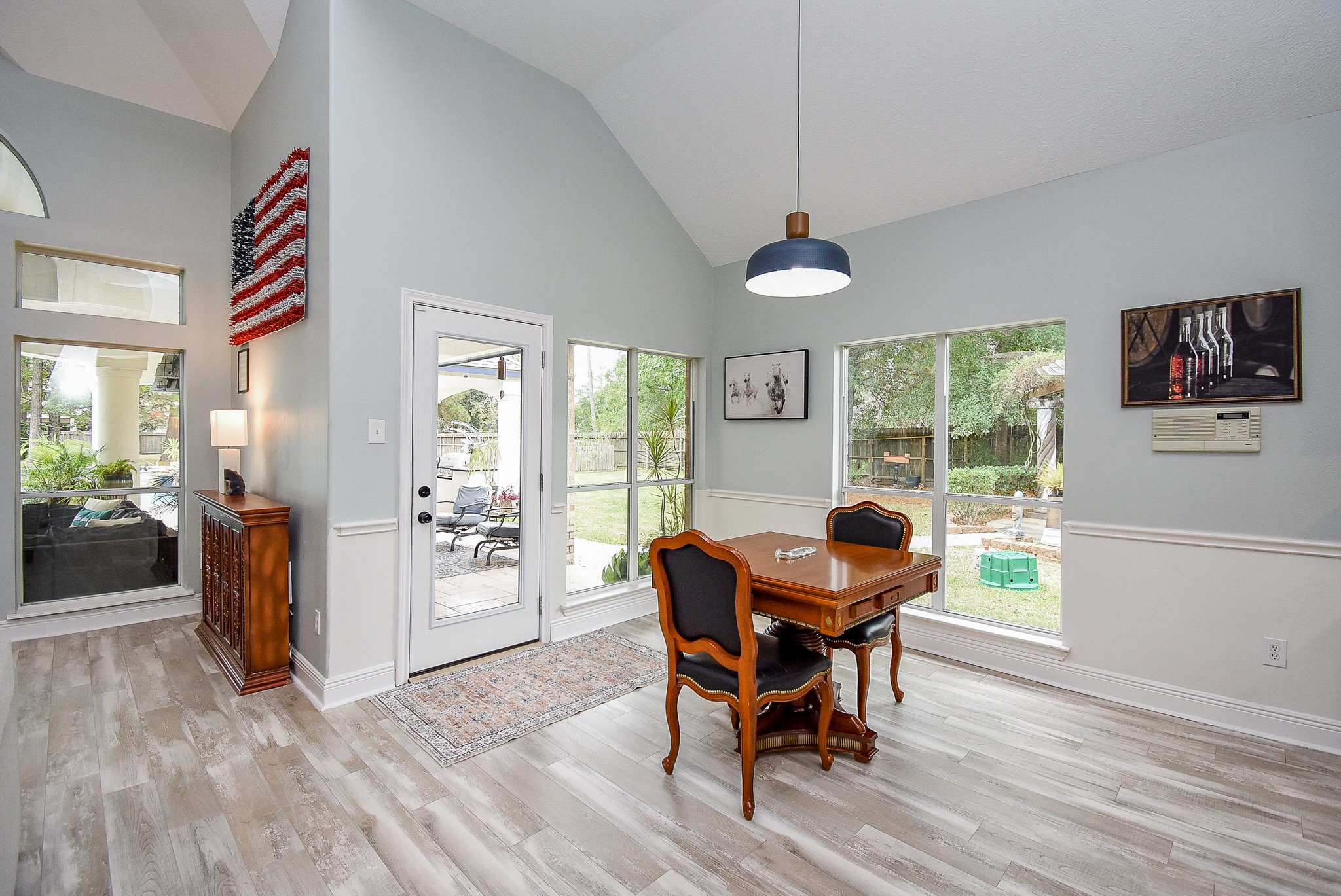 30518 Aldine Westfield Road Spring, TX 77386 - Photo 14 of 50 a dining room with furniture a chandelier and wooden floor