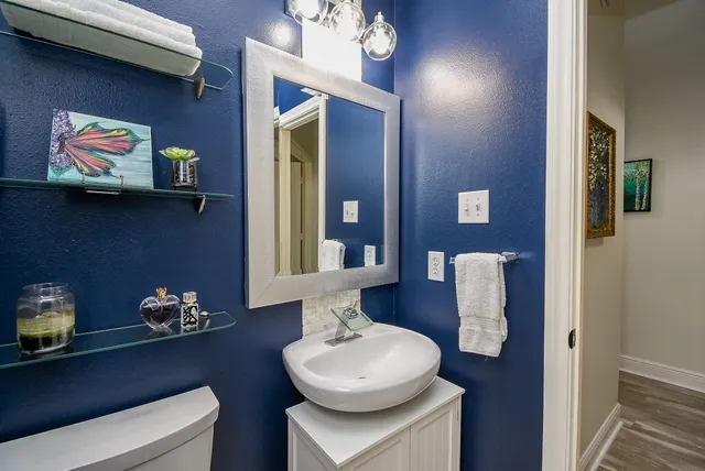 a bedroom with a bed couch and window