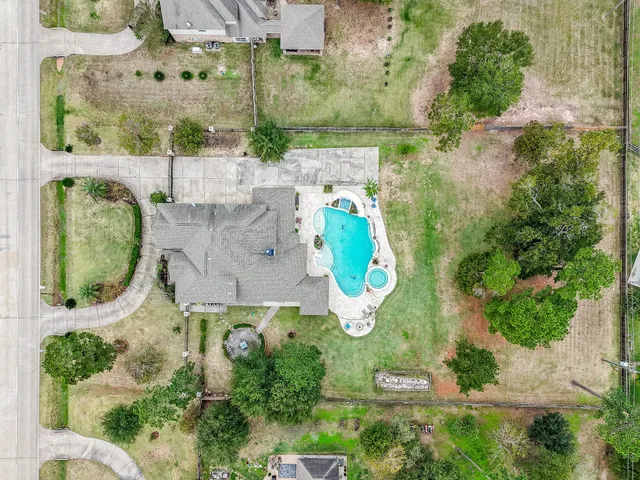 a front view of a house with a garden and plants