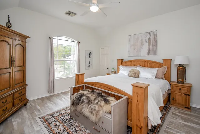 a bedroom with a bed and a dresser