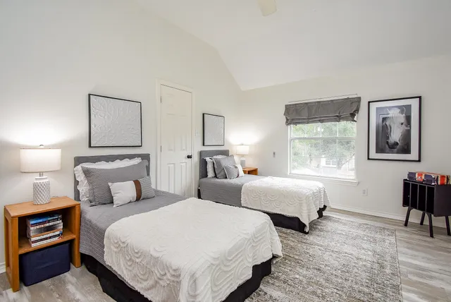 a living room with patio furniture and garden