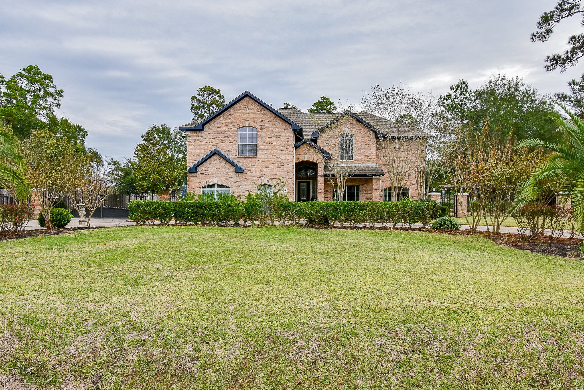 30518 Aldine Westfield Road Spring, TX 77386 - Photo 4 of 50 a front view of a house with a garden and plants