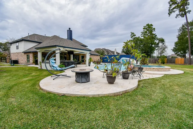 a view of a street with a building and trees in the background
