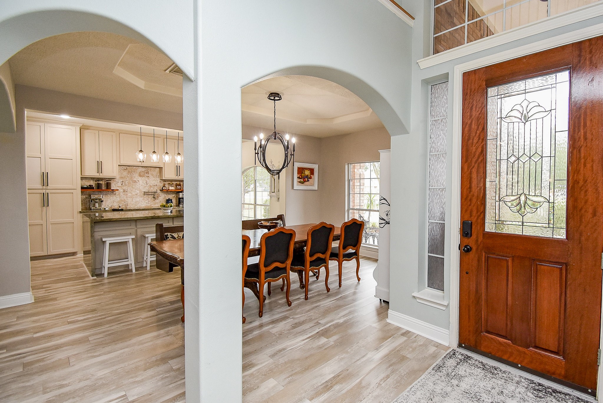 30518 Aldine Westfield Road Spring, TX 77386 - Photo 6 of 50 a view of a dining room and livingroom with furniture wooden floor a chandelier