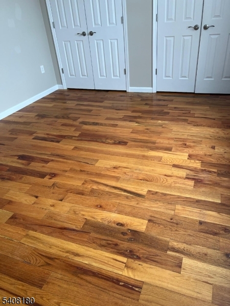 405 South 6th Street, Unit 1 Newark, NJ 07103 - Photo 3 of 8 a view of room and wooden floor