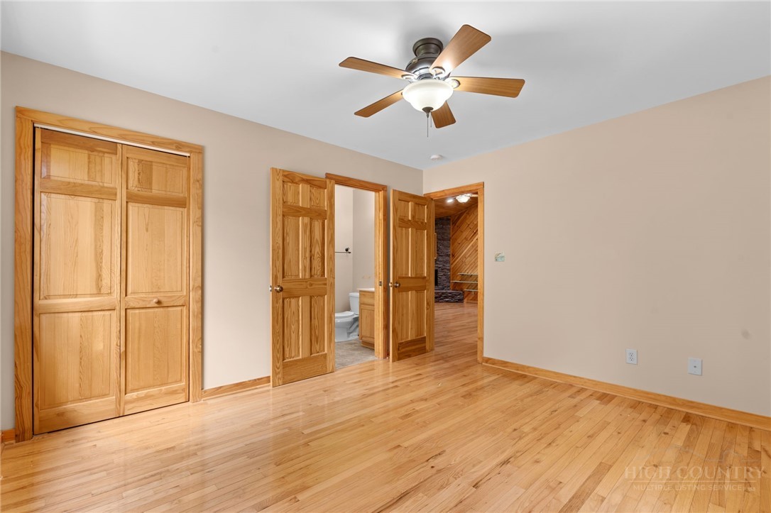 148 Woodby Ridge Road Vilas, NC 28692 - Photo 22 of 33 wooden floor in an empty room with a window