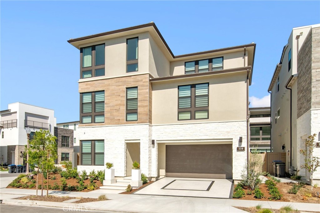 228 Stage Irvine, CA 92618 - Photo 1 of 1 a front view of a house with a yard
