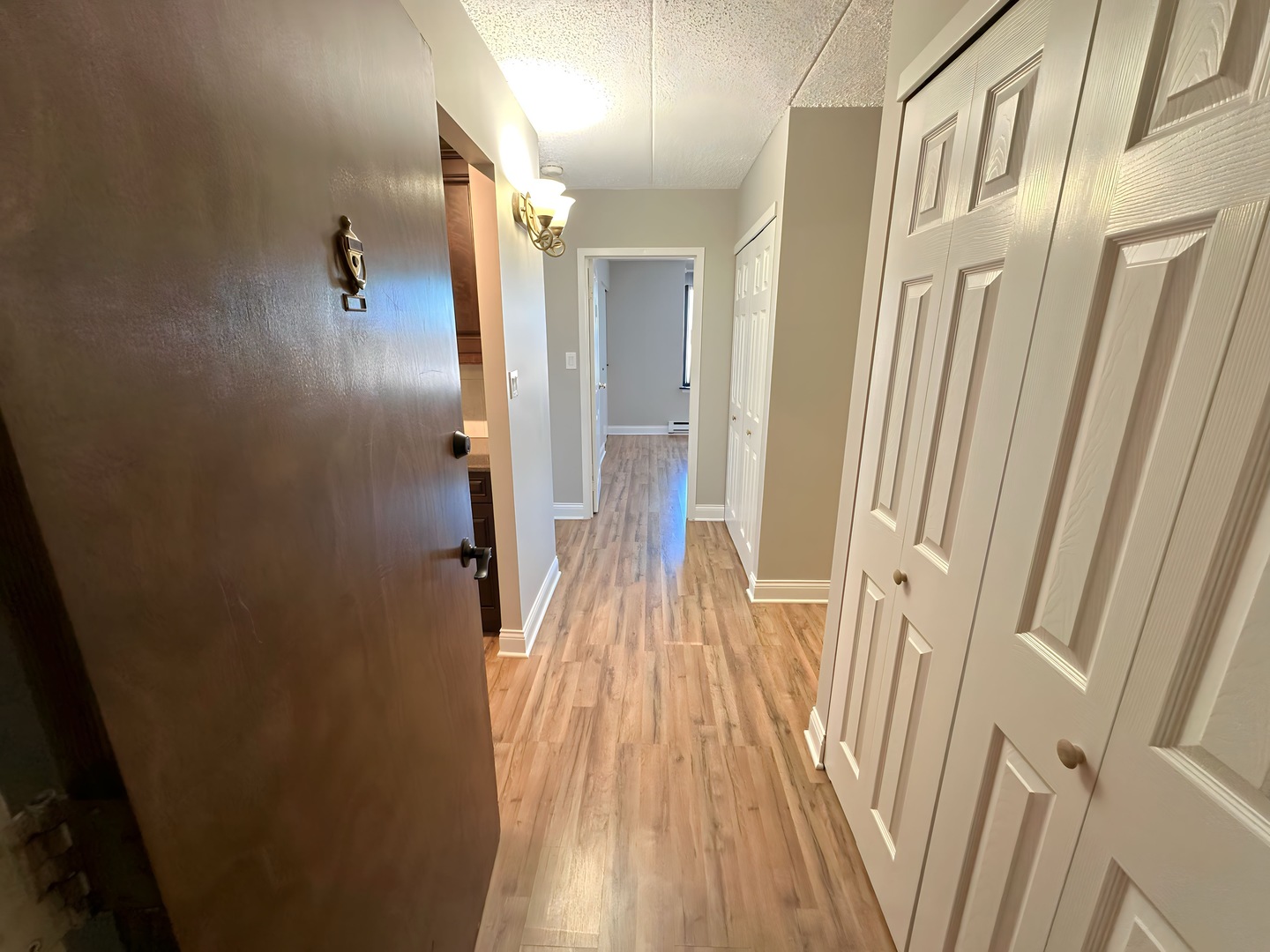 9074 West Terrace Drive, Unit 6D Niles, IL 60714 - Photo 2 of 14 a view of a hallway with wooden floor and staircase