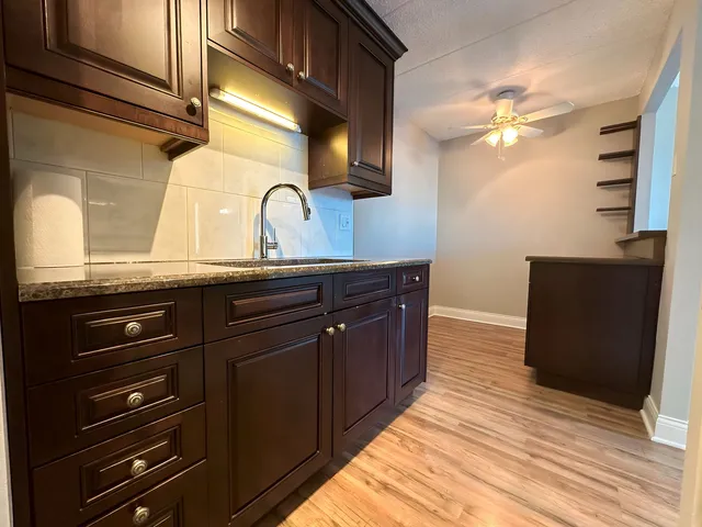 a kitchen with a sink and cabinets