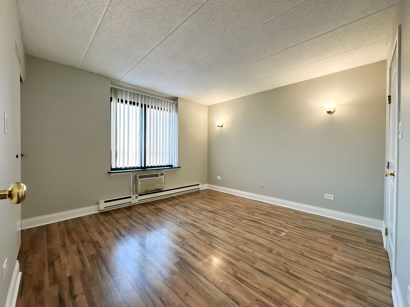 9074 West Terrace Drive, Unit 6D Niles, IL 60714 - Photo 9 of 14 an empty room with wooden floor and windows