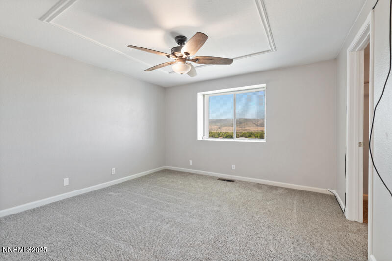 5005 Azurite Drive Reno, NV 89508 - Photo 16 of 33 an empty room with windows and fan