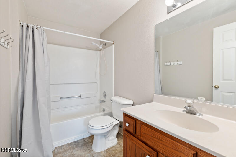 5005 Azurite Drive Reno, NV 89508 - Photo 17 of 33 a bathroom with a sink a toilet and shower