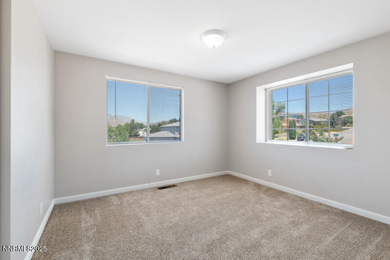 5005 Azurite Drive Reno, NV 89508 - Photo 18 of 33 an empty room with windows
