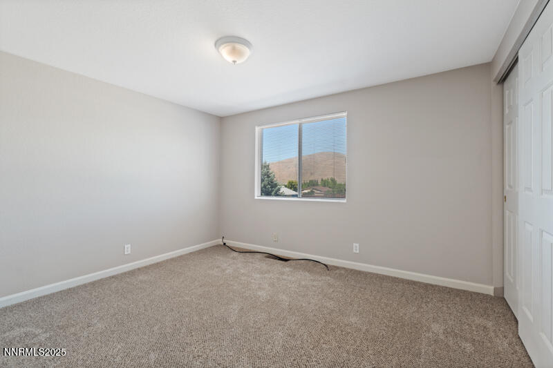 5005 Azurite Drive Reno, NV 89508 - Photo 19 of 33 an empty room with a window