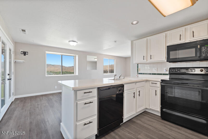 5005 Azurite Drive Reno, NV 89508 - Photo 3 of 33 a kitchen with a sink stove and cabinets