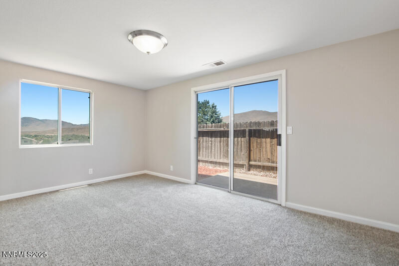 5005 Azurite Drive Reno, NV 89508 - Photo 6 of 33 a view of an empty room with a window