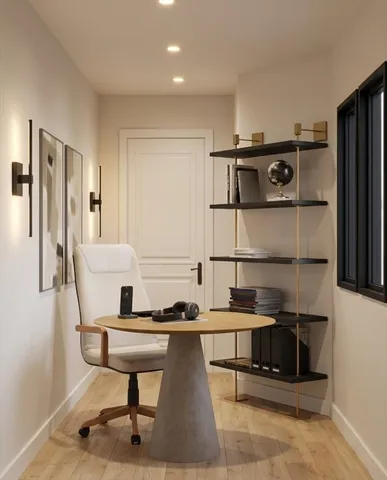a living room with stainless steel appliances furniture a refrigerator and rug