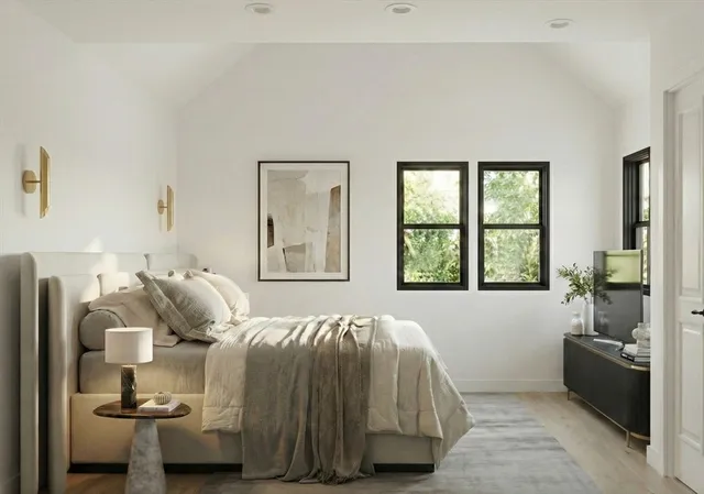 a bedroom with a bed and a window