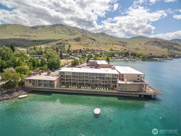 an aerial view of a house with lake view
