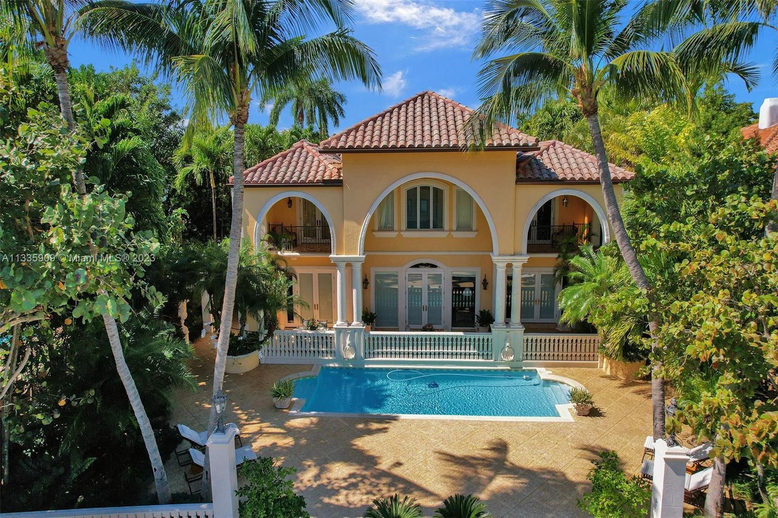 5369 Pine Tree Drive Miami Beach, FL 33140 - Photo 2 of 2 a front view of a house with a yard