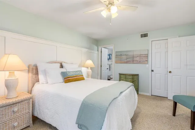 a living room with furniture a flat screen tv and a large window