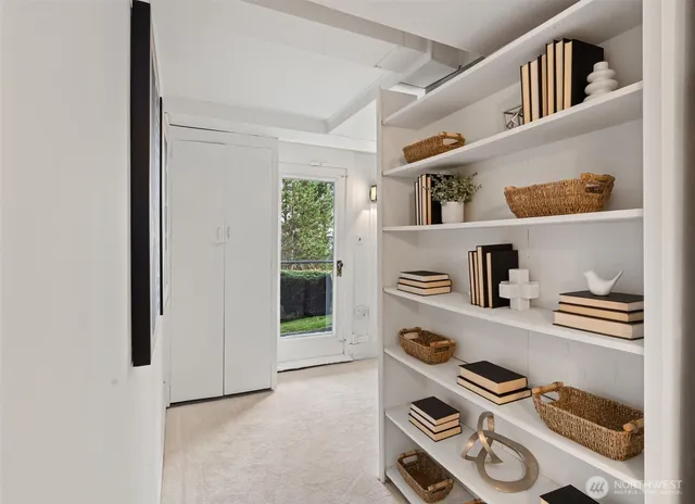 a bathroom with a sink a mirror a vanity and a shower