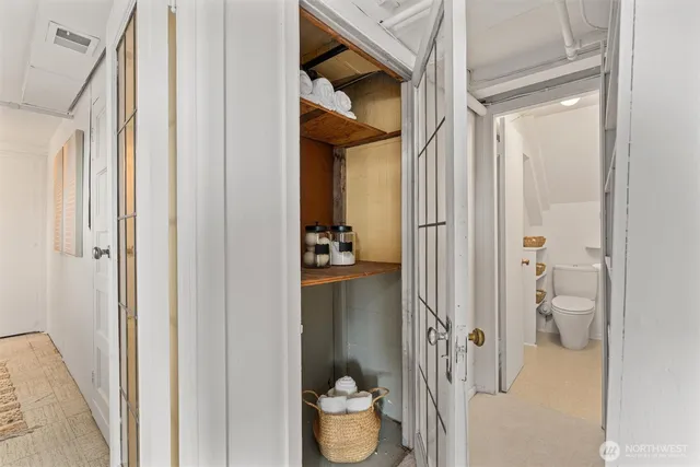 a bathroom with a toilet a sink and a mirror