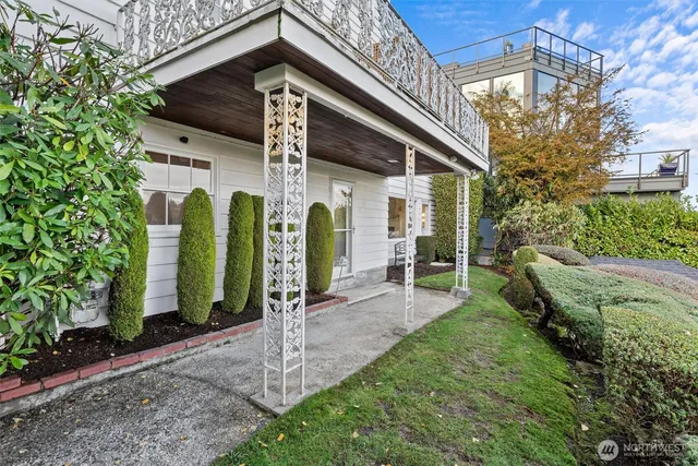 a view of a patio with couches table and chairs and potted plants