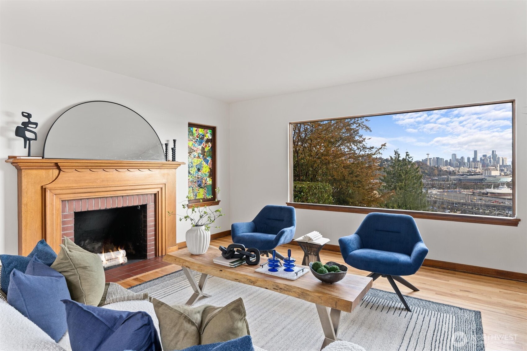 1820 Magnolia Way West Seattle, WA 98199 - Photo 4 of 33 a living room with furniture a fireplace and a large window