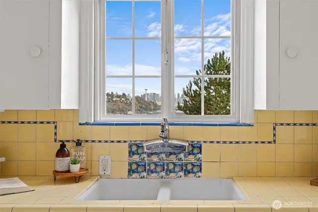 a dining room with furniture and a window