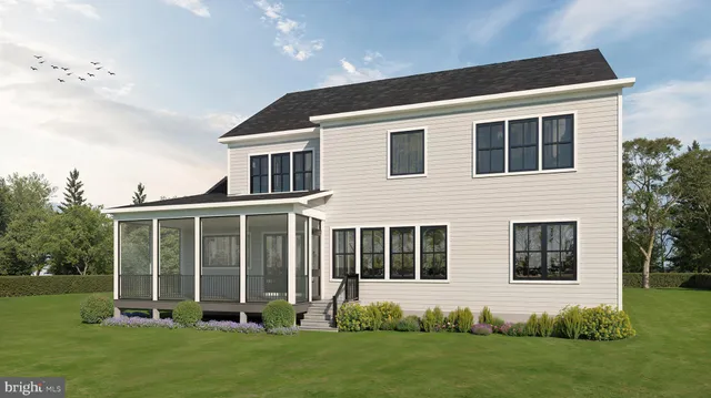 a front view of a house with a yard and porch