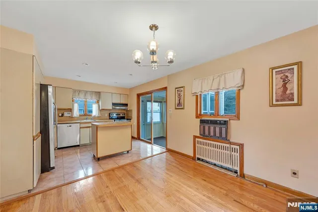 a kitchen with a refrigerator and a sink