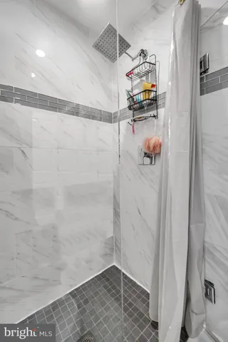 a picture of a bathroom with a shower