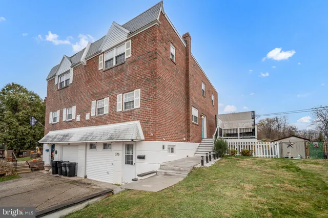 a view of a building with a yard