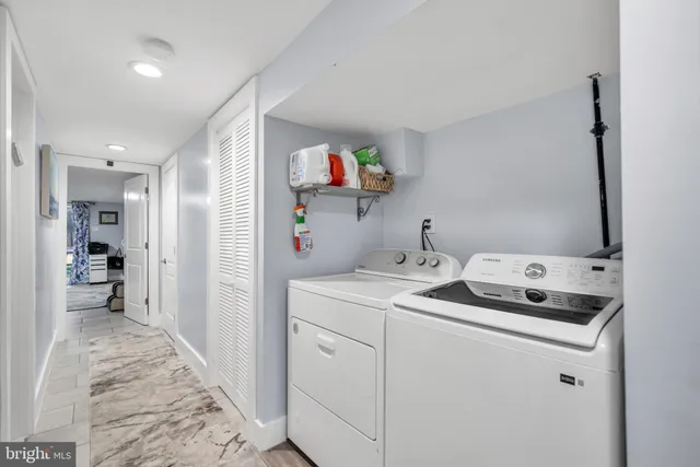 a room that has a sink and a bed in it