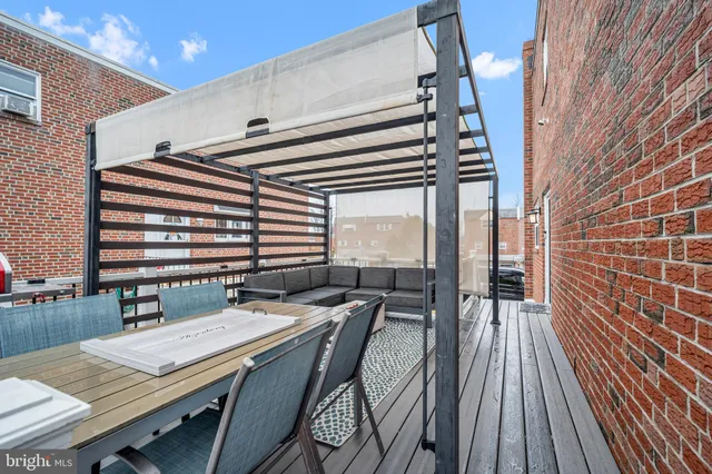 a balcony view with a sitting space