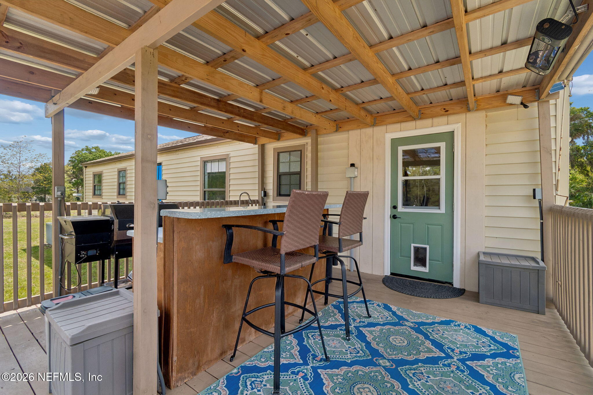 138 Bostwick Cemetery Road Palatka, FL 32177 - Photo 33 of 47 Covered deck with bar