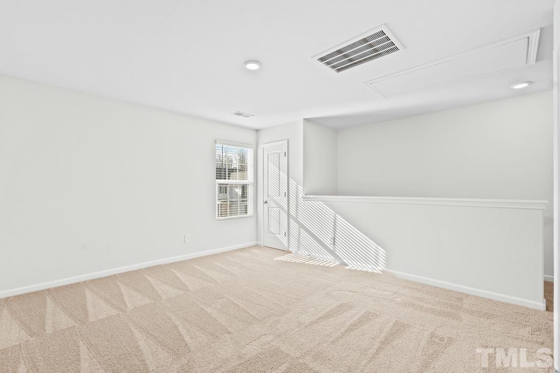 533 Crackling Court Zebulon, NC 27597 - Photo 14 of 14 a view of an empty room