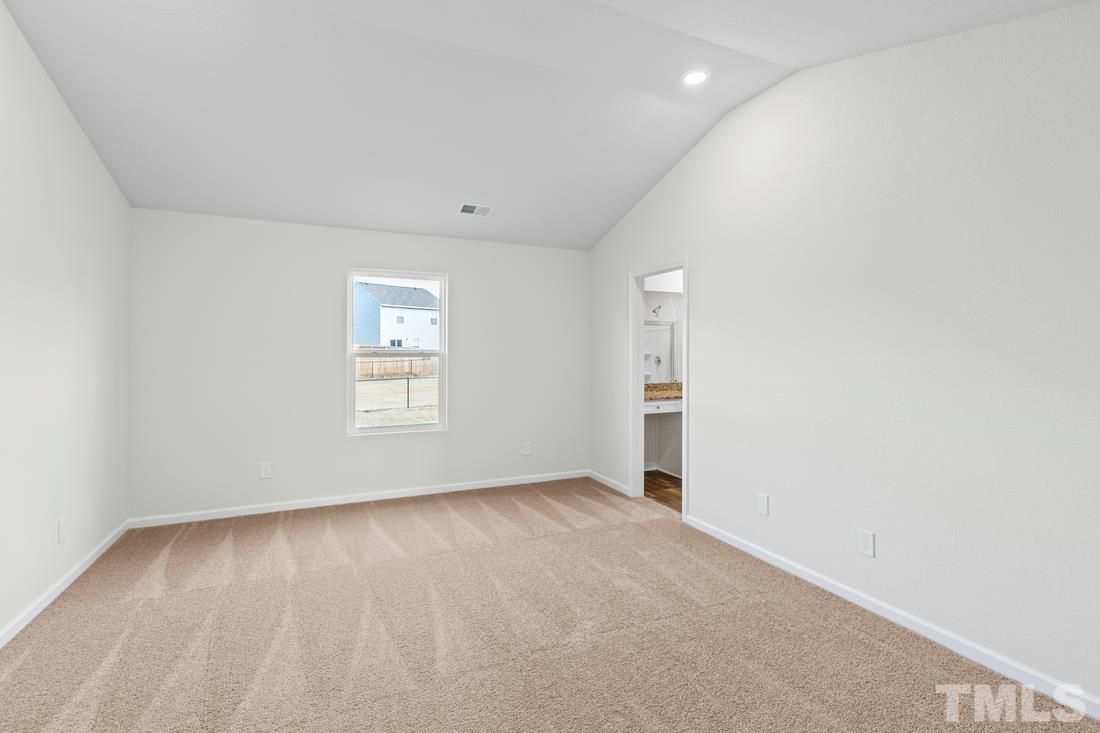 533 Crackling Court Zebulon, NC 27597 - Photo 9 of 14 an empty room with a window