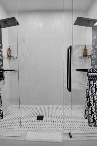 a bathroom with a bathtub and shower