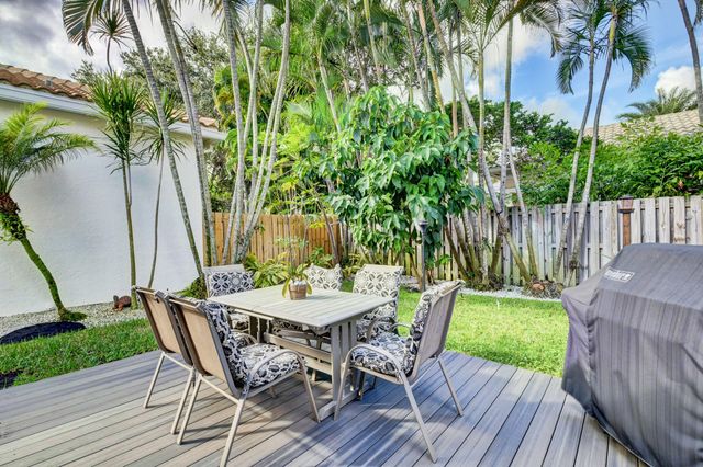 a view of a table and chairs in patio of a house