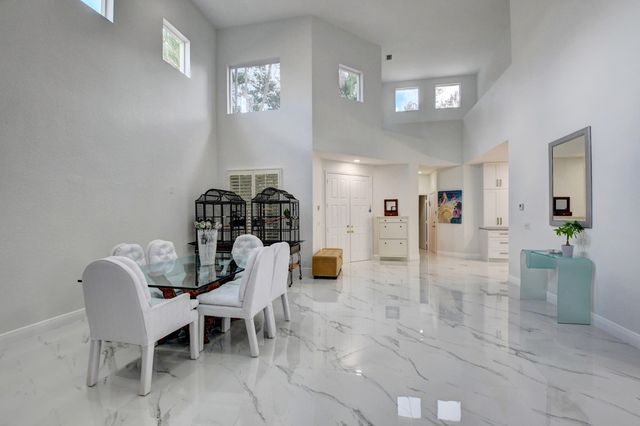 a view of a livingroom with furniture and windows