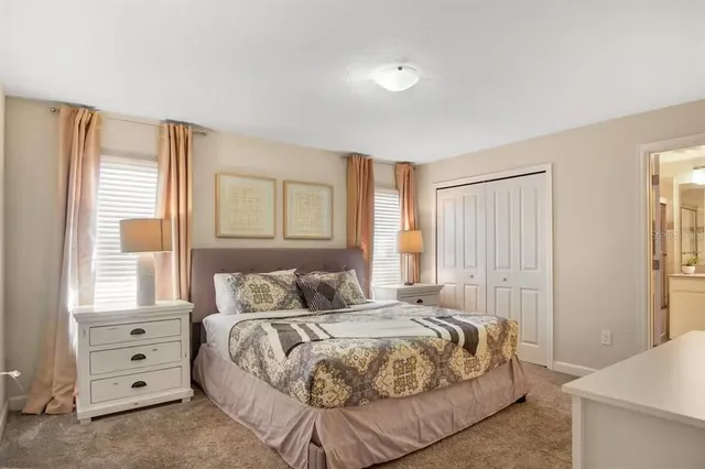 a bedroom with a bed and a dresser
