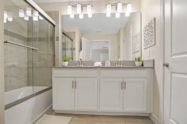 a bathroom with a sink a vanity and a mirror