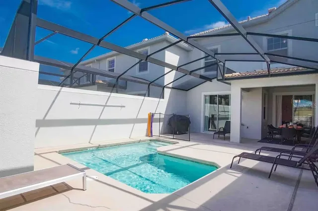 a view of a backyard with sitting area