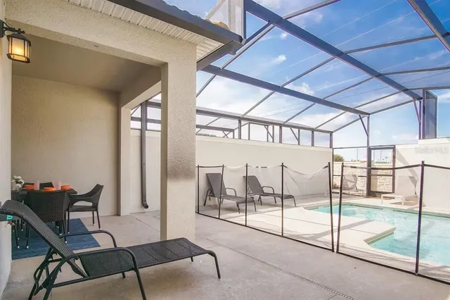 a view of a room with furniture and a ceiling fan