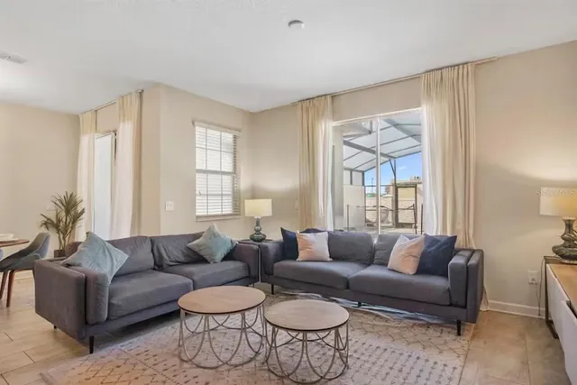 a living room with furniture and a large window