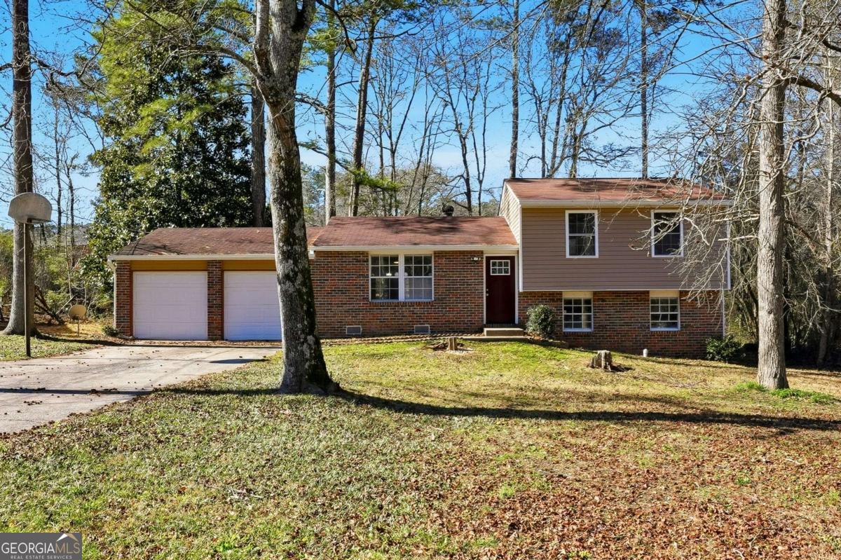 3579 Bramblevine Circle Lithonia, GA 30038 - Photo 1 of 25 a front view of a house with a yard